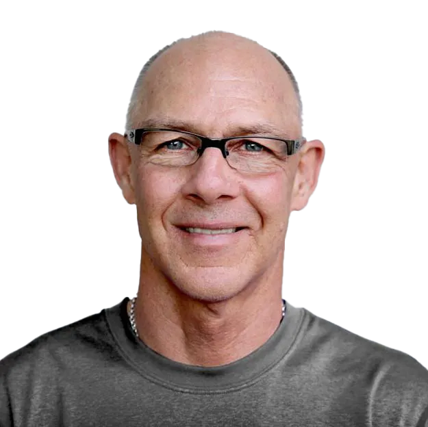 A man wearing glasses and a gray shirt.