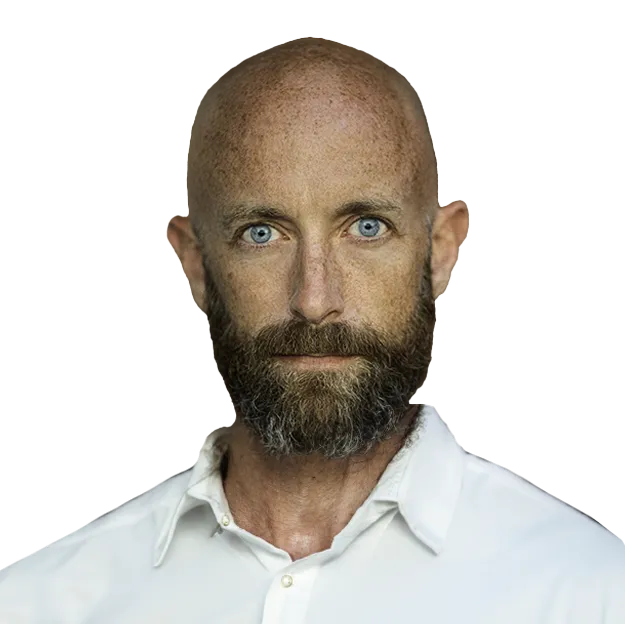 A man with a bald head and blue eyes.