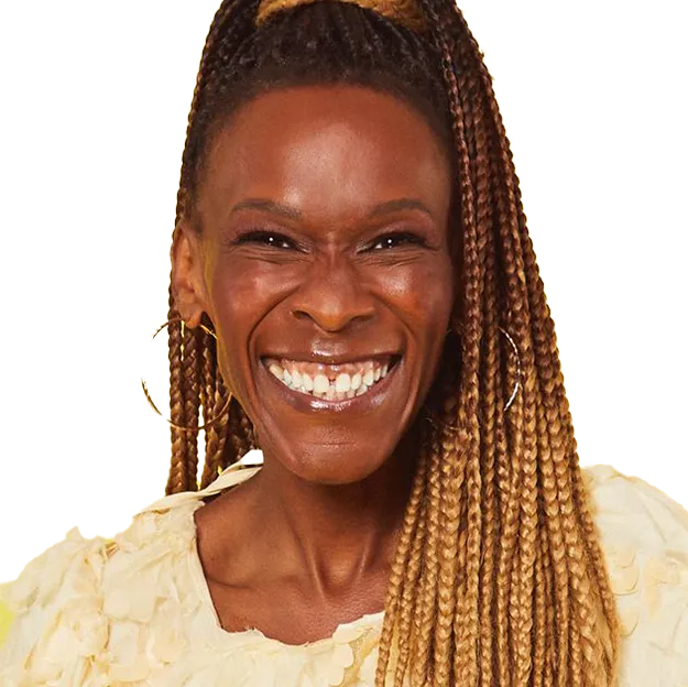 A smiling woman with braids on her hair.