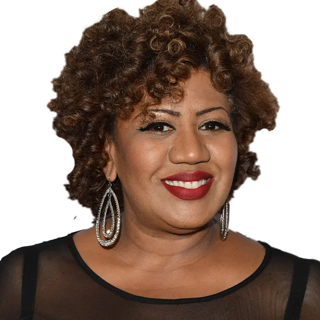 A woman with curly hair wearing a black top.