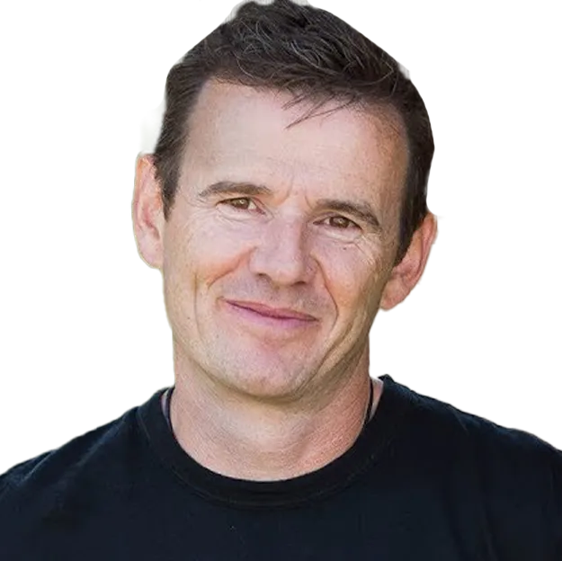 A man in a black shirt is smiling.