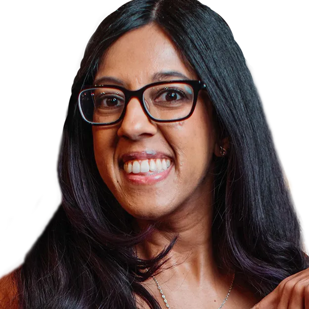 A woman wearing glasses is smiling for the camera.