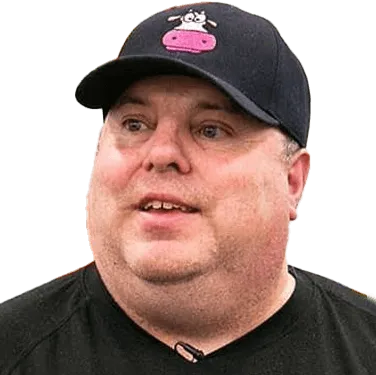 A man wearing a black hat and black shirt.