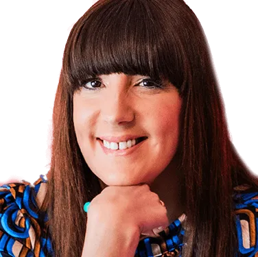 A woman with long brown hair wearing a blue dress.