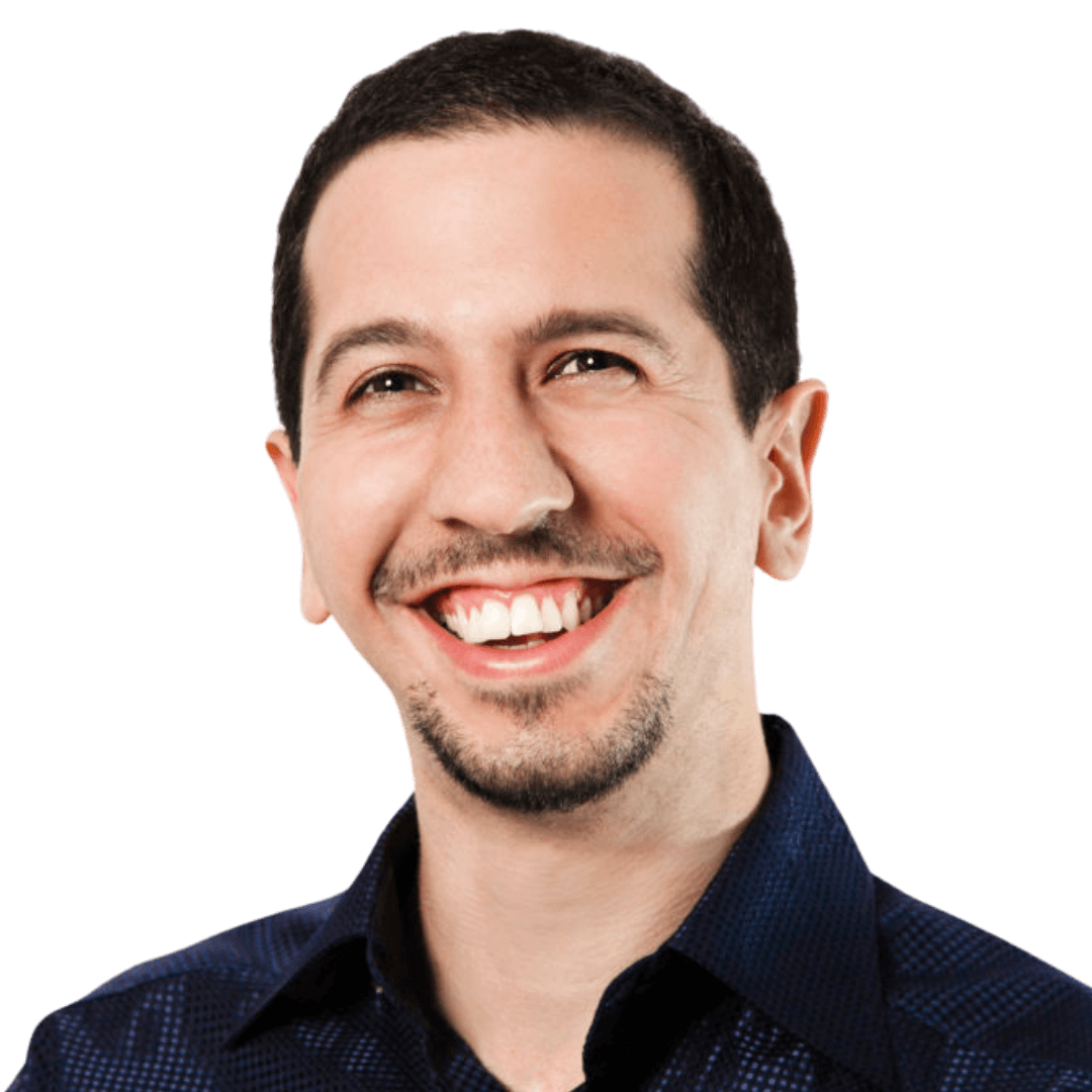 A man with a mustache smiling at the camera.